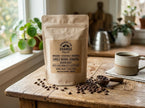 Custom brown kraft roll labels applied to an organic coffee pouch, highlighting eco-friendly recycled paper texture and earthy tones.