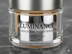 Custom kiss-cut mirror chrome stickers applied to a premium cosmetic jar, showcasing high-shine reflective metallic surfaces.