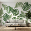 Large seamless UV wall art transfer featuring tropical monstera leaves applied directly to a living room drywall without visible plastic edges.