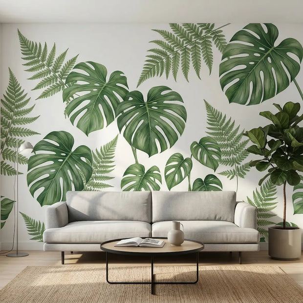 Large seamless UV wall art transfer featuring tropical monstera leaves applied directly to a living room drywall without visible plastic edges.