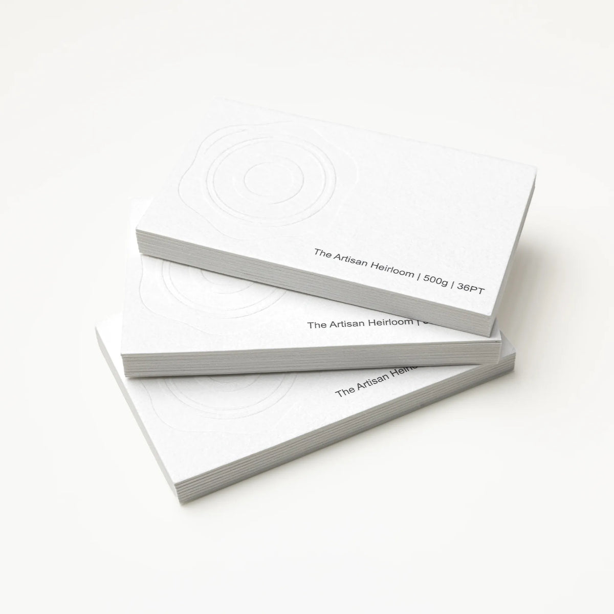 Stack of OTTORON BC02 premium 500g corporate business cards showcasing Blind Deboss.