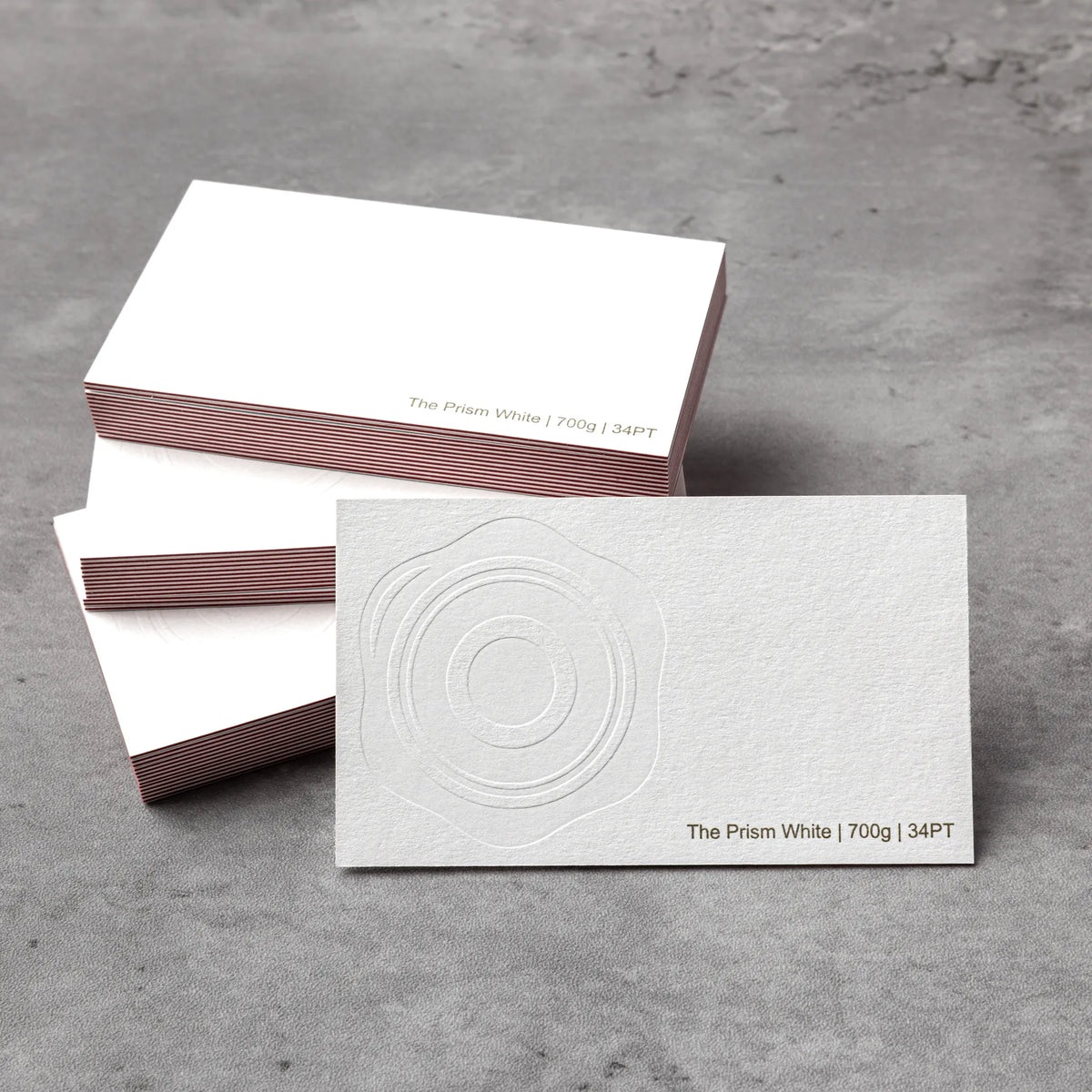 Professional executive desk setting featuring the OTTORON BC03 bespoke The Prism White business card.