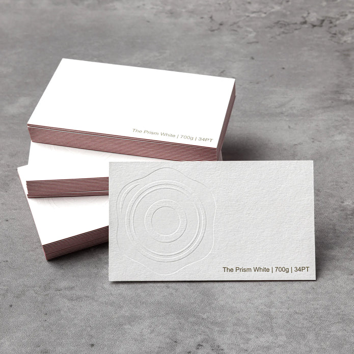 Professional executive desk setting featuring the OTTORON BC03 bespoke The Prism White business card.