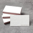 Professional executive desk setting featuring the OTTORON BC03 bespoke The Prism White business card.