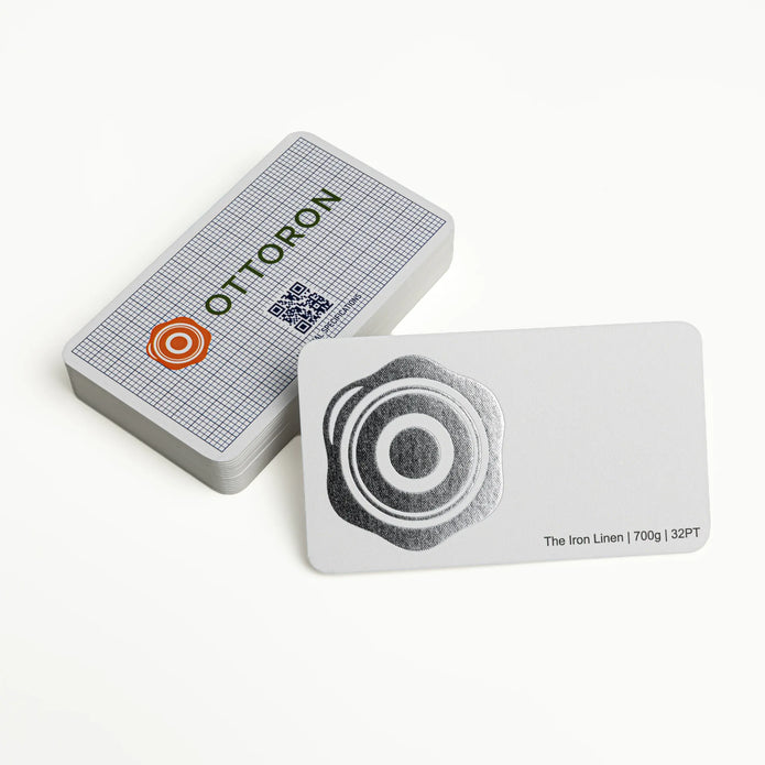 Stack of OTTORON BC07 premium 700g corporate business cards showcasing Bright Silver Foil, Round Corners.