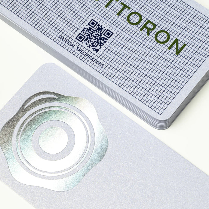 Professional executive desk setting featuring the OTTORON BC09 bespoke The Glacial Peak business card.
