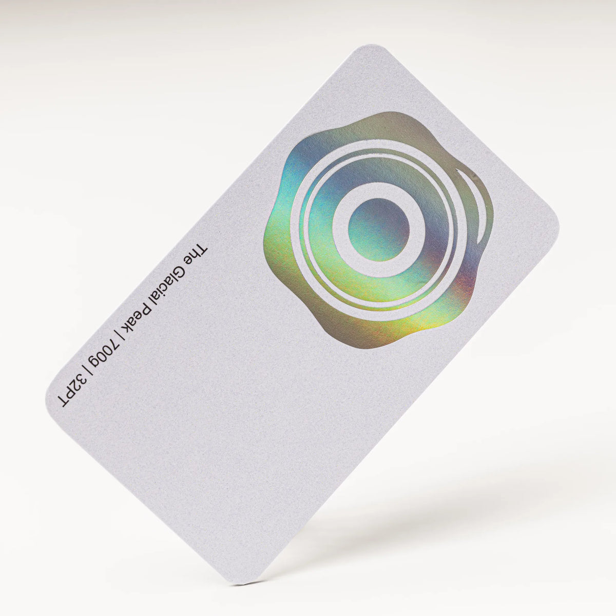 Stack of OTTORON BC09 premium 700g corporate business cards showcasing Holographic Silver Foil, Round Corners.