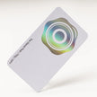 Stack of OTTORON BC09 premium 700g corporate business cards showcasing Holographic Silver Foil, Round Corners.