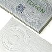 Macro photography of Bright Gold Foil applied on OTTORON BC14 The Silver Rhapsody custom stationery.