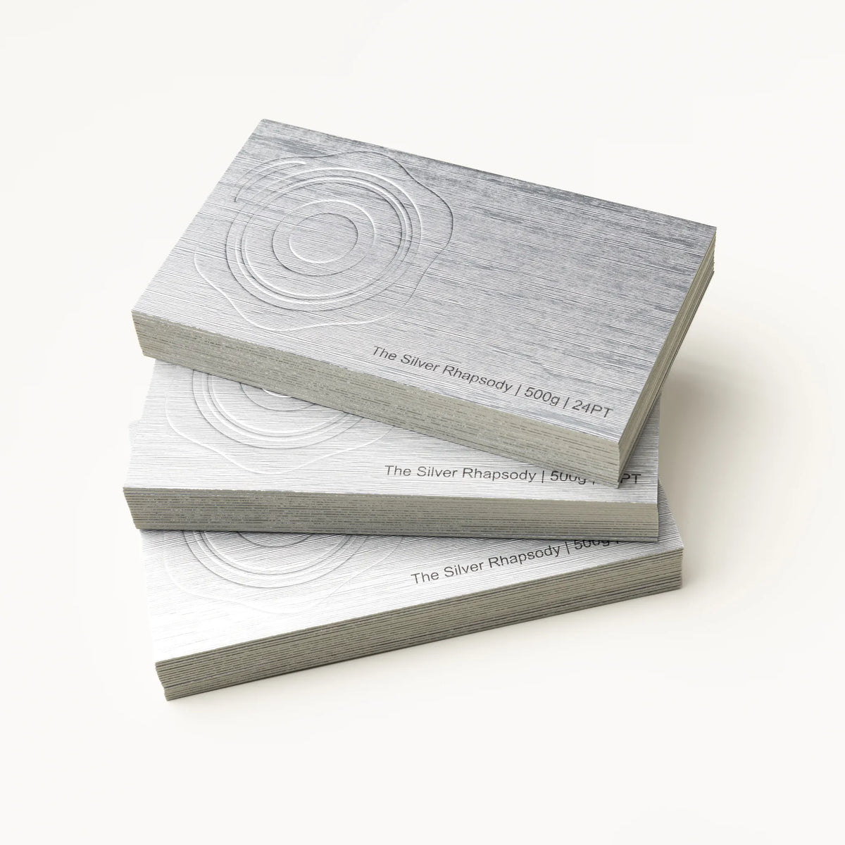 Professional executive desk setting featuring the OTTORON BC14 bespoke The Silver Rhapsody business card.