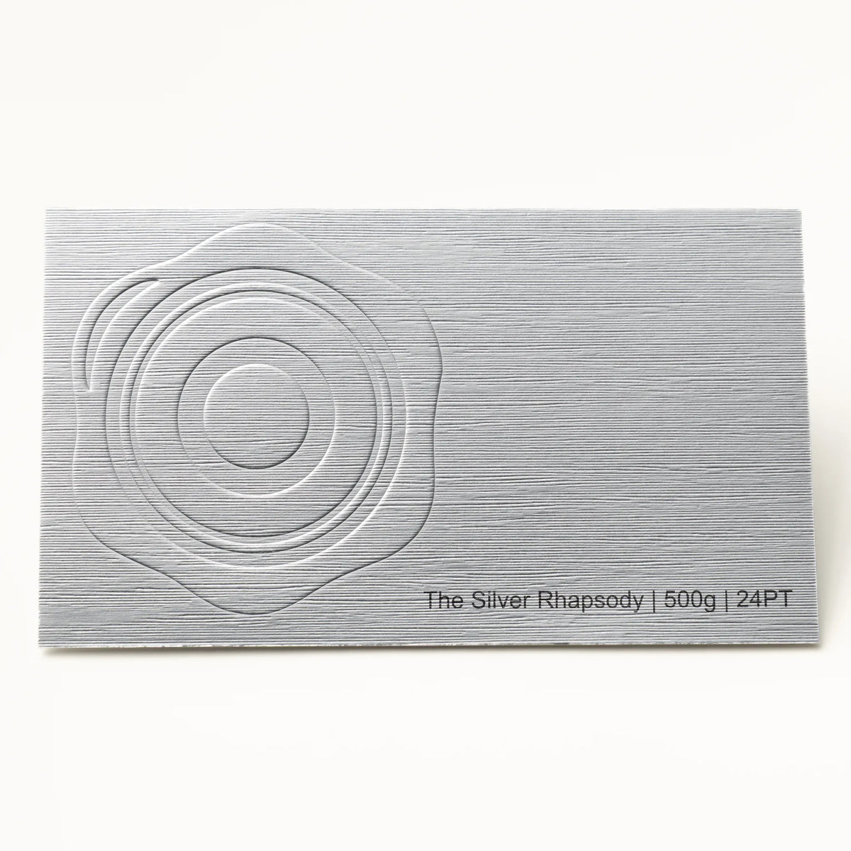 Close-up detail of The Silver Rhapsody texture on OTTORON BC14 bespoke business card highlighting Bright Gold Foil.