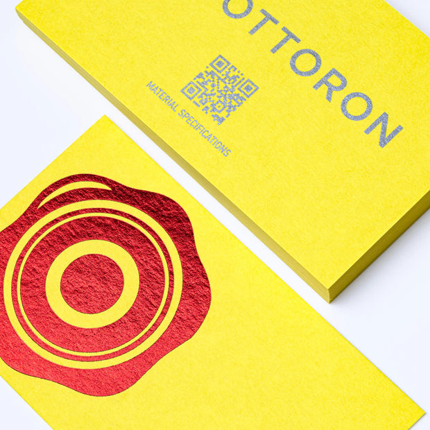 Professional executive desk setting featuring the OTTORON BC16 bespoke The Electric Citron business card.
