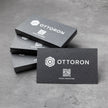 Close-up detail of The Obsidian Void texture on OTTORON BC20 bespoke business card highlighting Gold Ink Print.