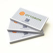 Professional executive desk setting featuring the OTTORON BC22 bespoke The Eco Architect business card.