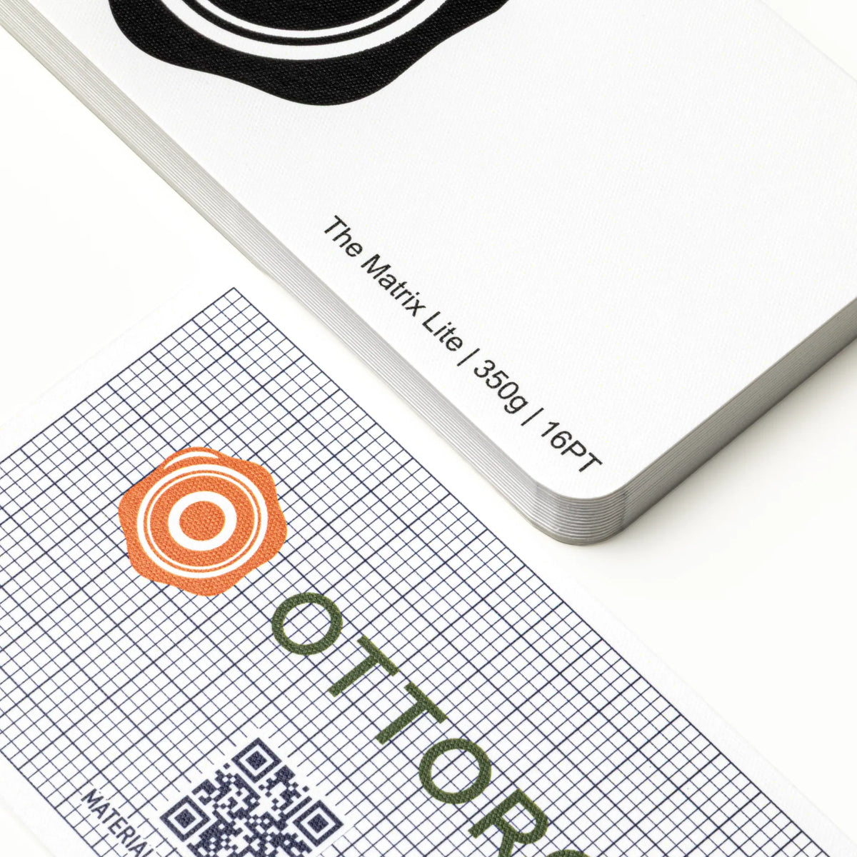 Professional executive desk setting featuring the OTTORON BC23 bespoke The Matrix Lite business card.