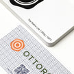 Professional executive desk setting featuring the OTTORON BC23 bespoke The Matrix Lite business card.