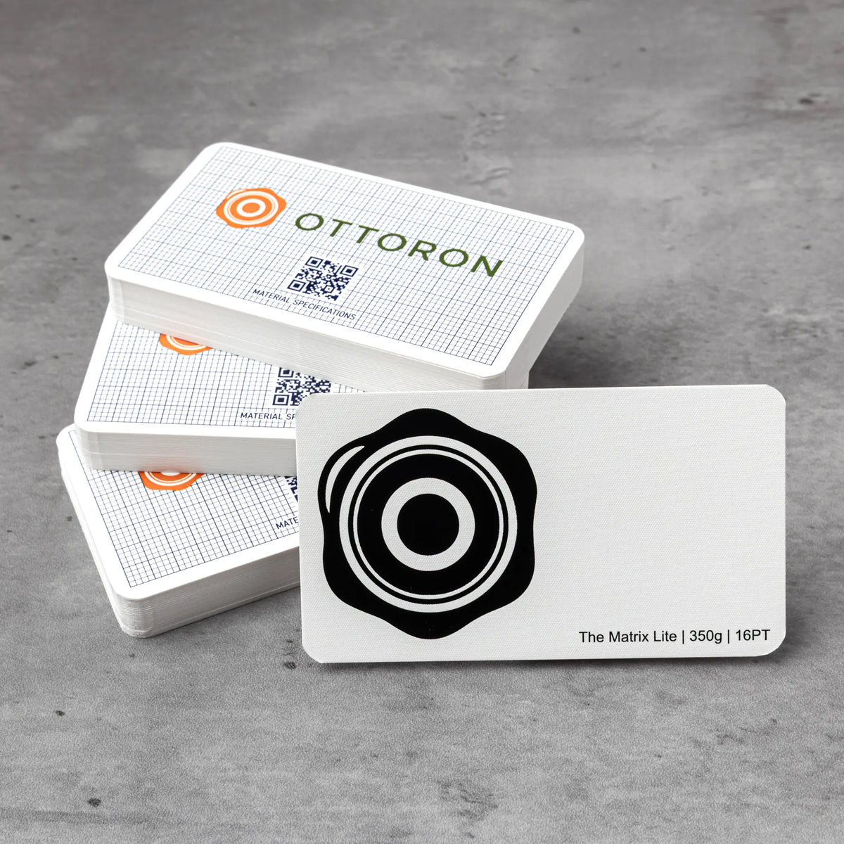 Stack of OTTORON BC23 premium 350g corporate business cards showcasing Black Foil, Round Corners, Foil Stamping.