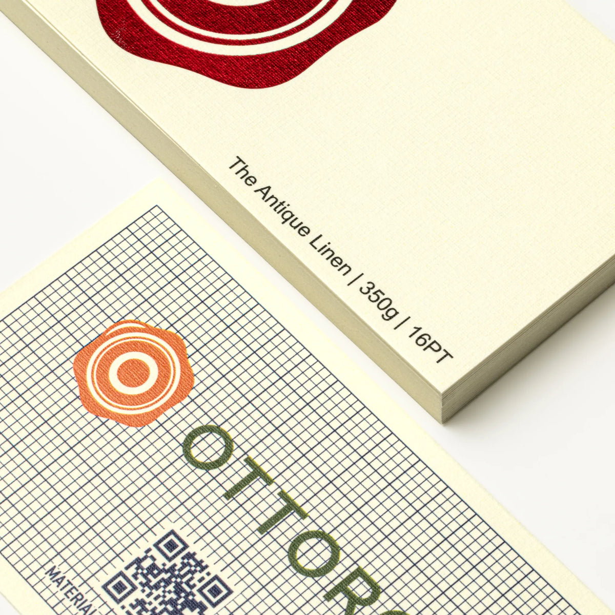 Professional executive desk setting featuring the OTTORON BC24 bespoke The Antique Linen business card.