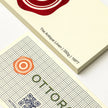 Professional executive desk setting featuring the OTTORON BC24 bespoke The Antique Linen business card.