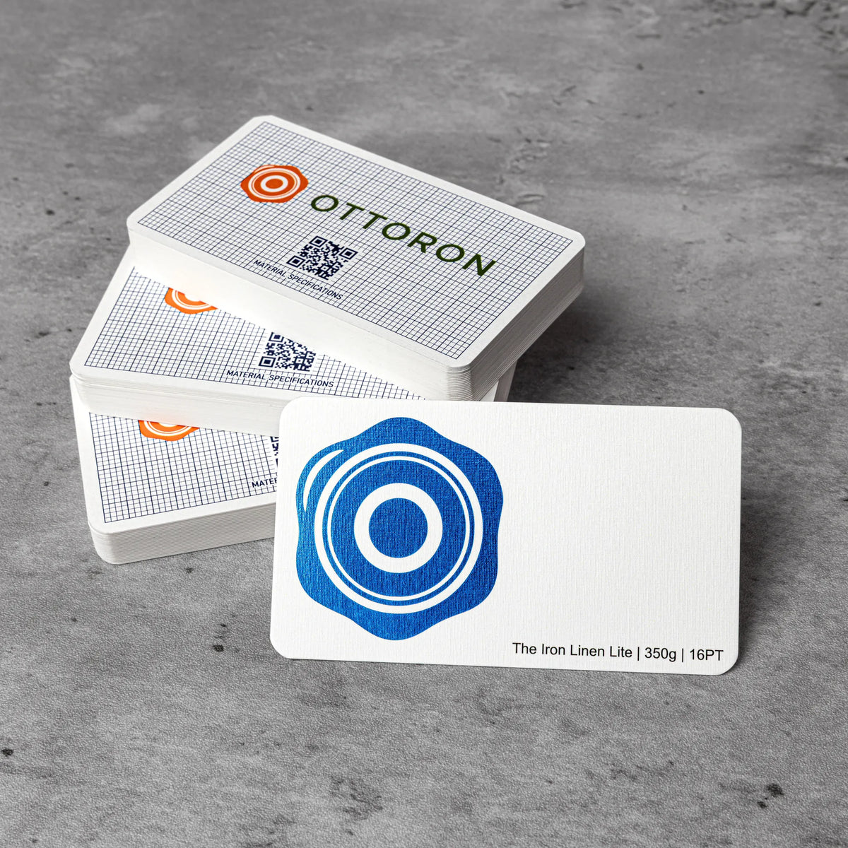Close-up detail of The Iron Linen Lite texture on OTTORON BC25 bespoke business card highlighting Foil Stamping.