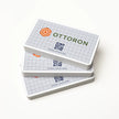 Side profile highlighting the impressive 16PT thickness of OTTORON BC25 The Iron Linen Lite high-end cards.