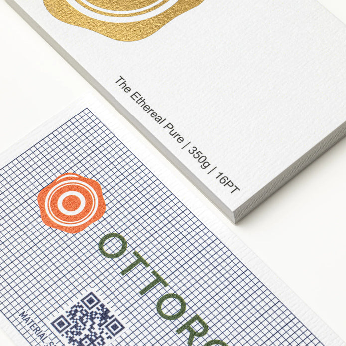 Professional executive desk setting featuring the OTTORON BC26 bespoke The Ethereal Pure business card.