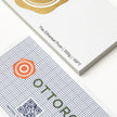 Professional executive desk setting featuring the OTTORON BC26 bespoke The Ethereal Pure business card.