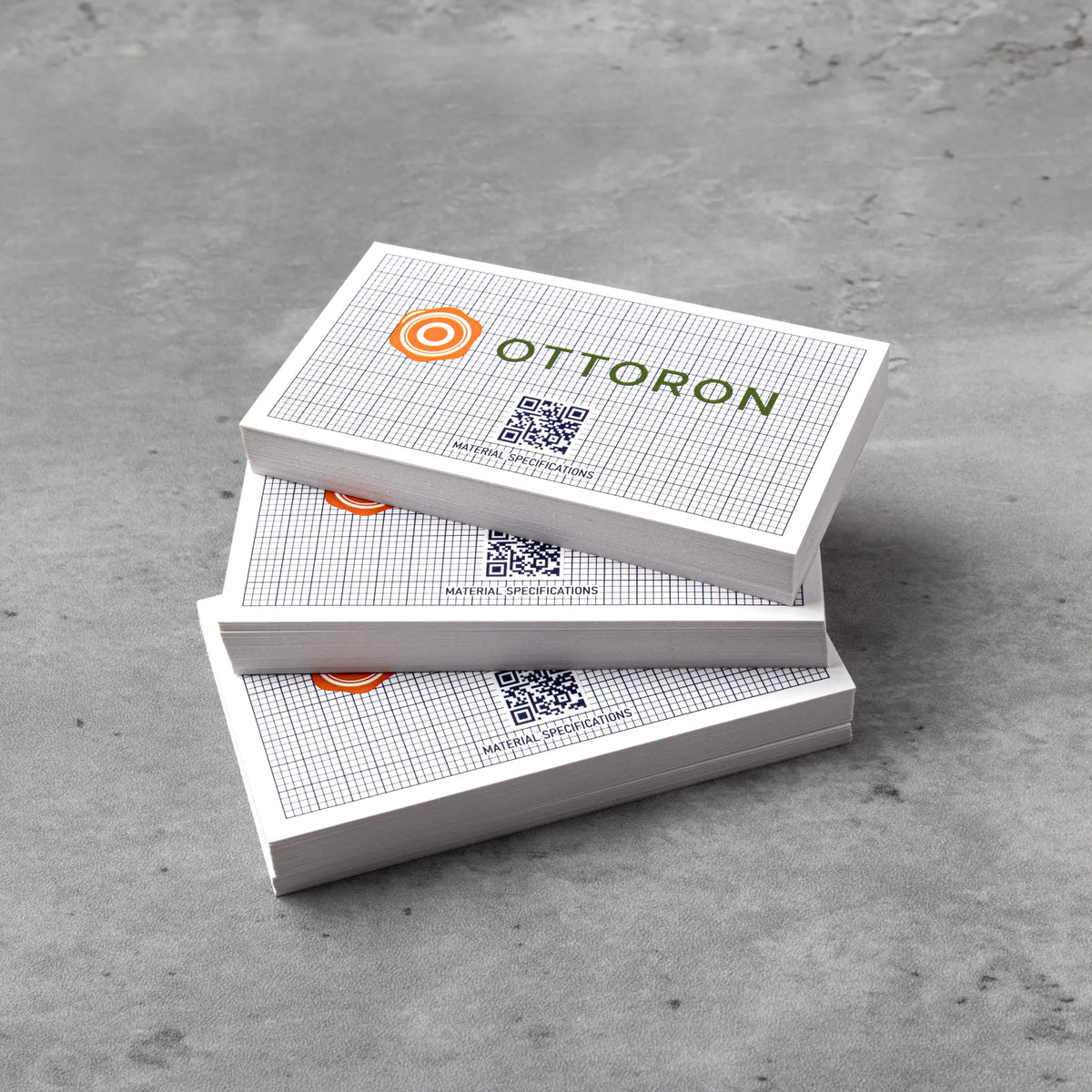 Stack of OTTORON BC28 premium 340g corporate business cards showcasing Black Foil.