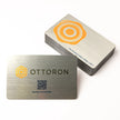 OTTORON BC34 The Brushed Silver 600g Luxury Business Card, featuring 3D Raised UV, front perspective view.